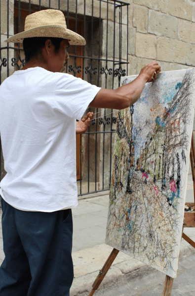 Local art. From those who are making art in the streets, like the man in the photo who is making an art with threads, to the various museums that have given fame to the whole state of being one of the most innovative and creative ones. I believe the magic comes by the combination of great ideas with Mexican folklore art!